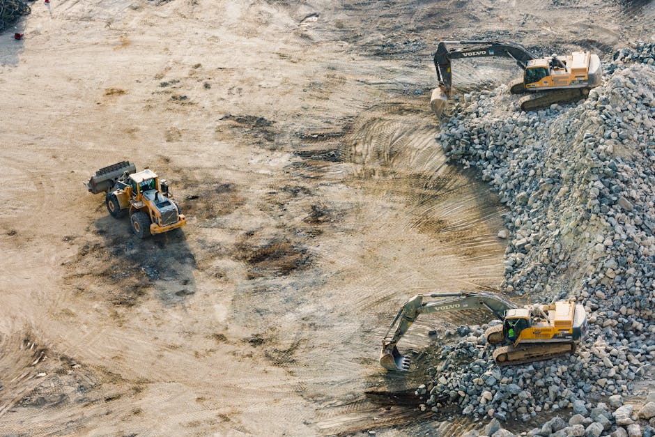 Aerial shot of heavy machinery working on a construction site in Dubai